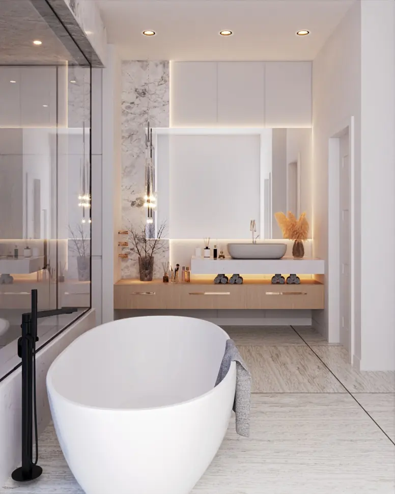 Primary bath looking past the freestanding tub to the vanity and mirror