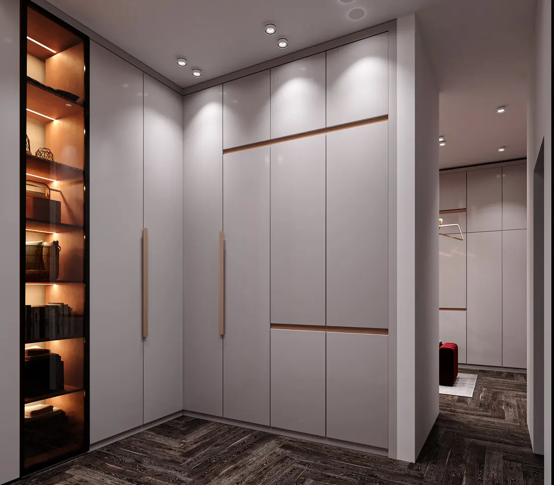 His walk in closet with lit shelving and full height wardrobe fronts