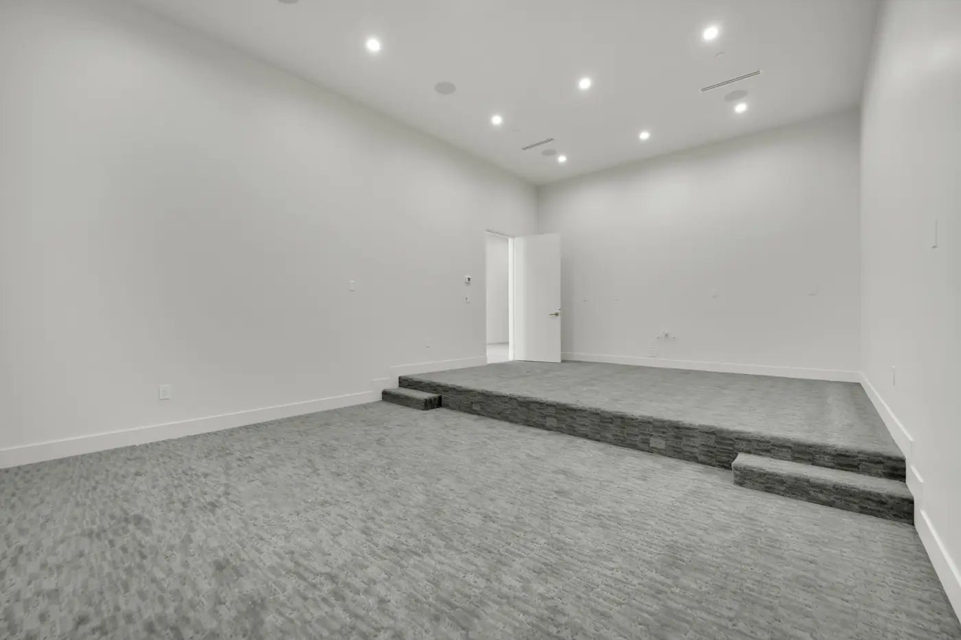 Media room with the floor stepped for tiered seating
