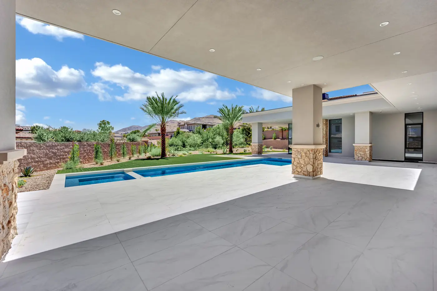 Covered patio floor running toward the pool