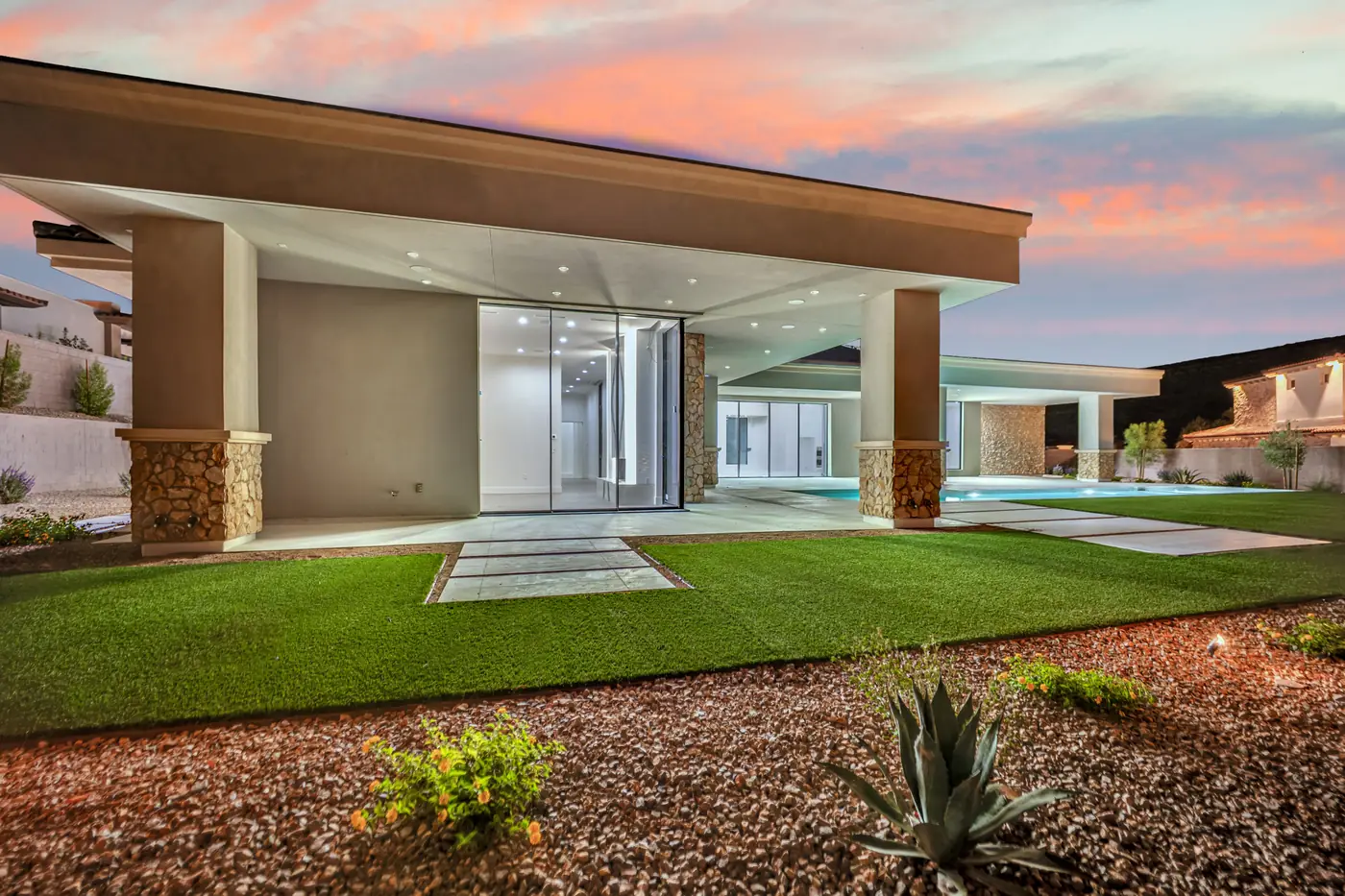 Covered patio at dusk looking through the house